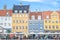 Copenhagen, Denmark - August 25, 2014 - Scenic summer view of Nyhavn pier canel with color buildings, ships, yachts