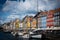 Copenhagen, Denmark - July, 2019: Copenhagen iconic view. Famous old Nyhavn port with colorful medieval ho