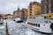 Copenhagen. Denmark March 3, 2018. Copenhagen frozen canal with beautiful ships. Natural phenomena. Architecture.