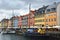COPENHAGEN, DENMARK - MAY 31, 2017: people in open cafes of the famous Nyhavn promenade.