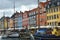 COPENHAGEN, DENMARK - MAY 31, 2017: people in open cafes of the famous Nyhavn promenade. Nyhavn a 17th century harbour in