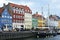 COPENHAGEN, DENMARK - MAY 31, 2017: people in open cafes of the famous Nyhavn promenade. Nyhavn a 17th century harbour in Copenhag