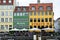 COPENHAGEN, DENMARK - MAY 31, 2017: people in open cafes of the famous Nyhavn promenade. Nyhavn a 17th century harbour in Copenhag