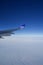 COPENHAGEN, DENMARK - NOV 24th, 2018: Wing of an airplane cruising above the clouds