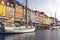 Copenhagen, Denmark  - September 22, 2019  New Haven water canal in Copenhagen, lots of sailing boats, people and colorful houses