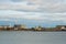 COPENHAGEN, DENMARK: White windmills on the horizon on the waterfront. Beautiful panoramic view from the waterfront