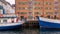 COPENHAGEN, DENMARK â€“ View from the canal towards the empty promenade by the canal in the port of Nyhavn