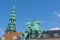 Copenhagen, Equastrian statue of Absalon and tower of Nicolai Church, Hojbro Square, Copenhagen, Denmark