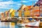 Copenhagen iconic view. Famous old Nyhavn port in the center of Copenhagen, Denmark during summer sunny day