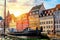 Copenhagen iconic view. Famous old Nyhavn port in the center of Copenhagen, Denmark during summer sunny day sunset