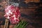 Coppa, Capocollo, Capicollo Cured ham on meat cleaver. Dark wooden background. Top view. Copy space