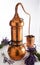 Copper Alembic distiller for essential oils with lavender bouquets