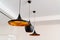 Copper chandelier painted black on ceiling. lighting in interior