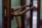 Copper door ornate handle in itlaian cafe