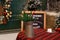 A copper jug â€‹â€‹and fir branches stand on table. Christmas decorations.