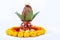 Copper Kalash with coconut , leaf and floral decoration on a white background. essential in hindu puja.