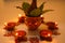 Copper Kalash with coconut , leaf and floral decoration on a white background. essential in hindu puja.