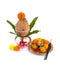 Copper Kalash with coconut and mango leaf and pooja thali with diya, kumkum and sweets with floral decoration