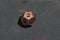 Copper metallic d12 twelve sided dice on foam surface