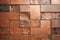 Copper mosaic background. Bronze random wall decoration. Cubic backdrop. Geometric illustration of glossy square shapes.