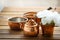 Copper old scratched vintage crockery kitchenware on the table