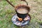 copper pan on fire with soup during a Middle Ages historic reenactment