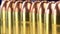 Copper plated bullets with brass slugs lined in a row - Gun control concept