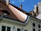 Copper roof flashing on old Rococo style building under blue sky