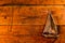 Copper Sailboat on Textured Wood