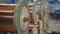 Copper wire winding on coils on industrial machines at factory.