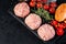 Copy space. Fast food. Convenience food, fast home cooking.Three chicken burgers wrapped in bacon with a rosemary sprig, red