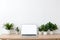 Copy space mockup template laptop monitor with a white screen on a wooden table. Cozy minimalistic workplace at home