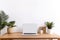 Copy space mockup template laptop monitor with a white screen on a wooden table. Cozy minimalistic workplace at home