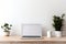 Copy space mockup template laptop monitor with a white screen on a wooden table. Cozy minimalistic workplace at home