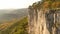 COPY SPACE: Spectacular shot of a male climber moving towards the top of a cliff