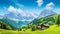 copy space, stockphoto, beautiful view on a traditional austrian little village in the mountains, magestic mountains