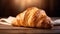 copy space, stockphoto, Croissant on a wooden table. National Croissant Day concept. Taste fresh croissant
