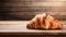 copy space, stockphoto, Croissant on a wooden table. National Croissant Day concept. Taste fresh croissant.