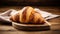 copy space, stockphoto, Croissant on a wooden table. National Croissant Day concept. Taste fresh croissant.