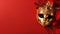 copy space, stockphoto, Festive Venetian carnival mask with gold decorations on red background.