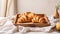 copy space, stockphoto, Fresh french croissants in a wooden tray on a linen tablecloth. Beautiful photo for breakfast bar