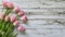 copy space, stockphoto, springtime pink tulips on white rustic wooden background for Mothers Day. Mother\\\'s day mockup.