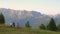 COPY SPACE: Three friends on mountain bikes observe the scenic sunlit mountains.