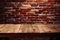 Copy space Wooden table against red brick wall backdrop