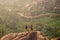 Copy spase lady and boy hugging Hampi ruins hills meeting sunrise sunset