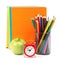 Copybooks with fresh apple and alarm clock