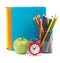 Copybooks with green apple and alarm clock