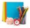 Copybooks with piggy bank and alarm clock