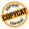 COPYCAT text written on orange-black round stamp sign