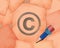 Copyright C symbol and small pencil with it